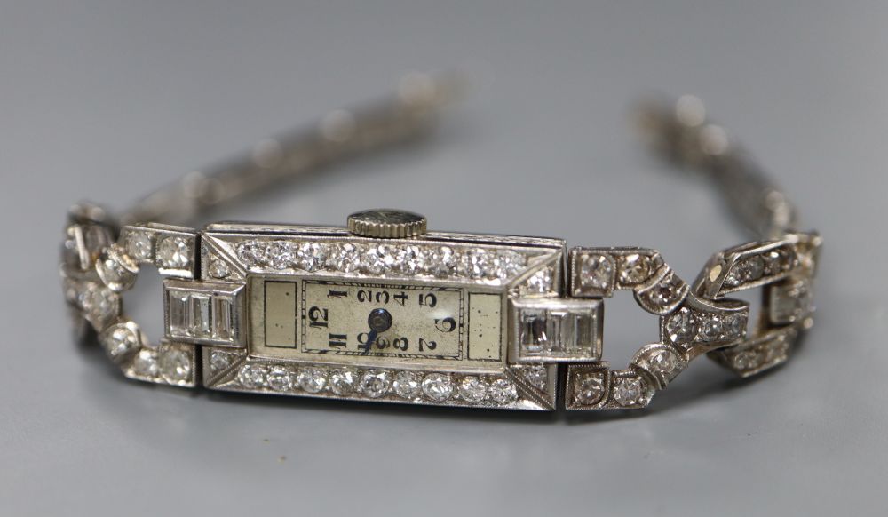 A ladys Art Deco white metal (stamped All Plat) and diamond set cocktail watch,